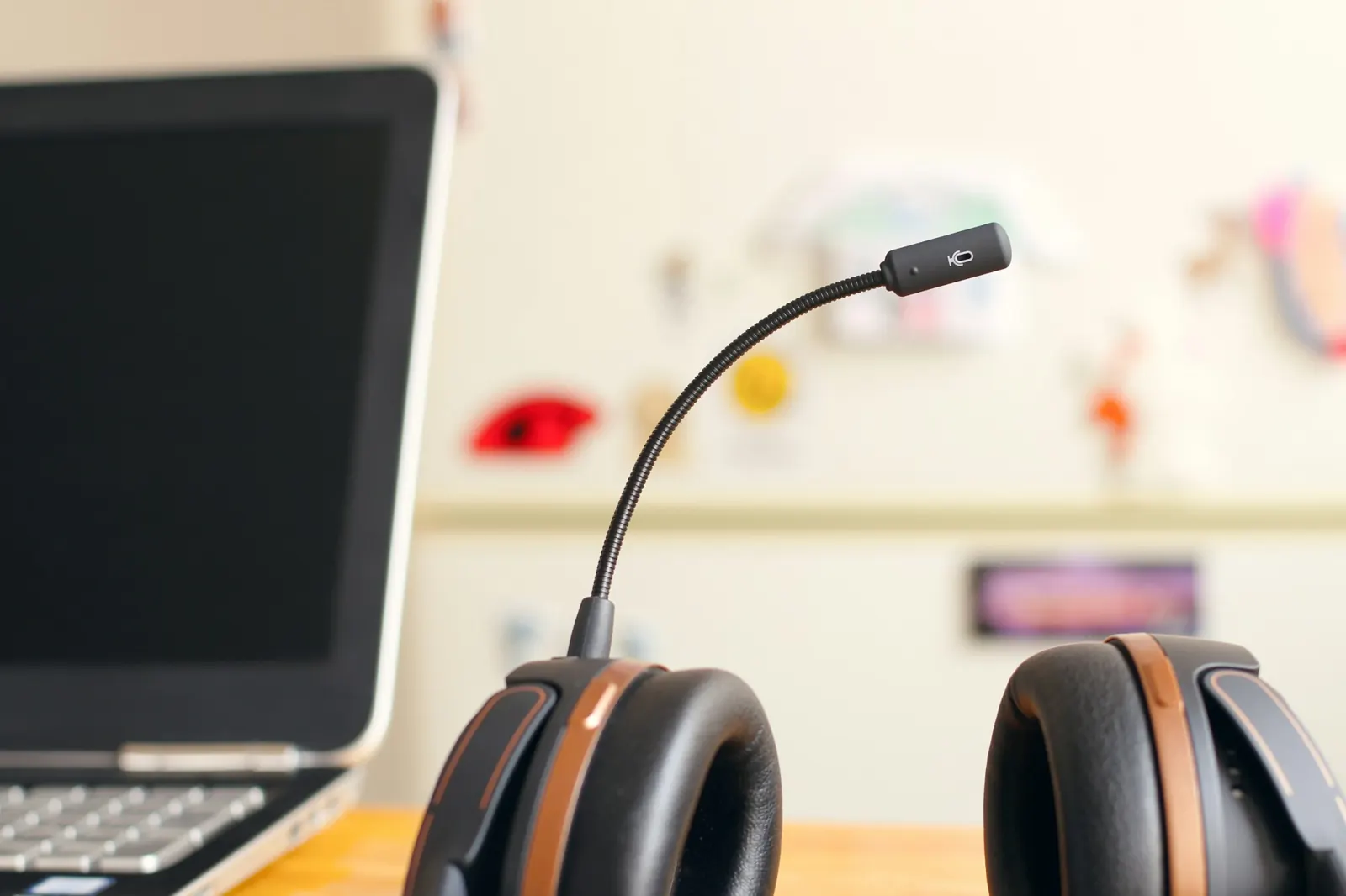 Customer service headset with microphone next to a laptop, representing a GDPR-compliant AI voice agent